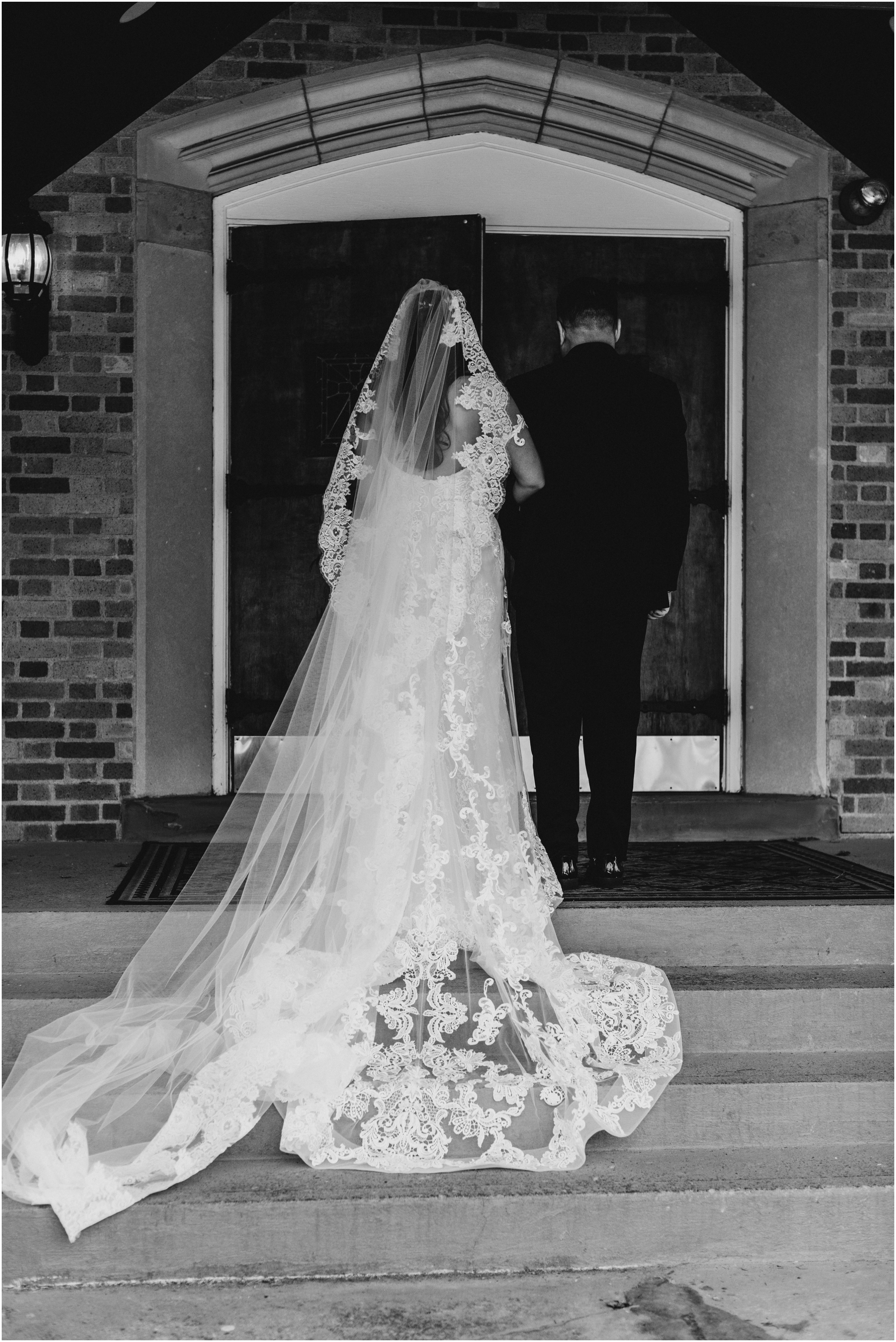 bride waiting to walk down aisle with father