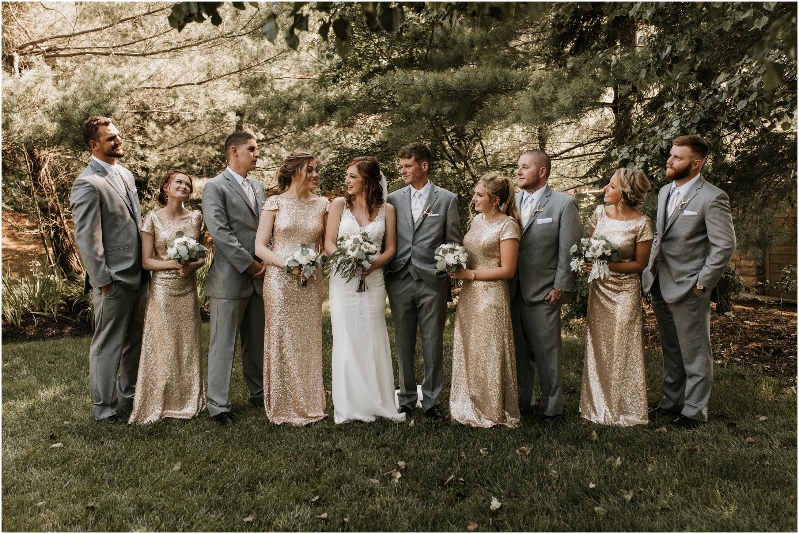 bridal party looking at each other