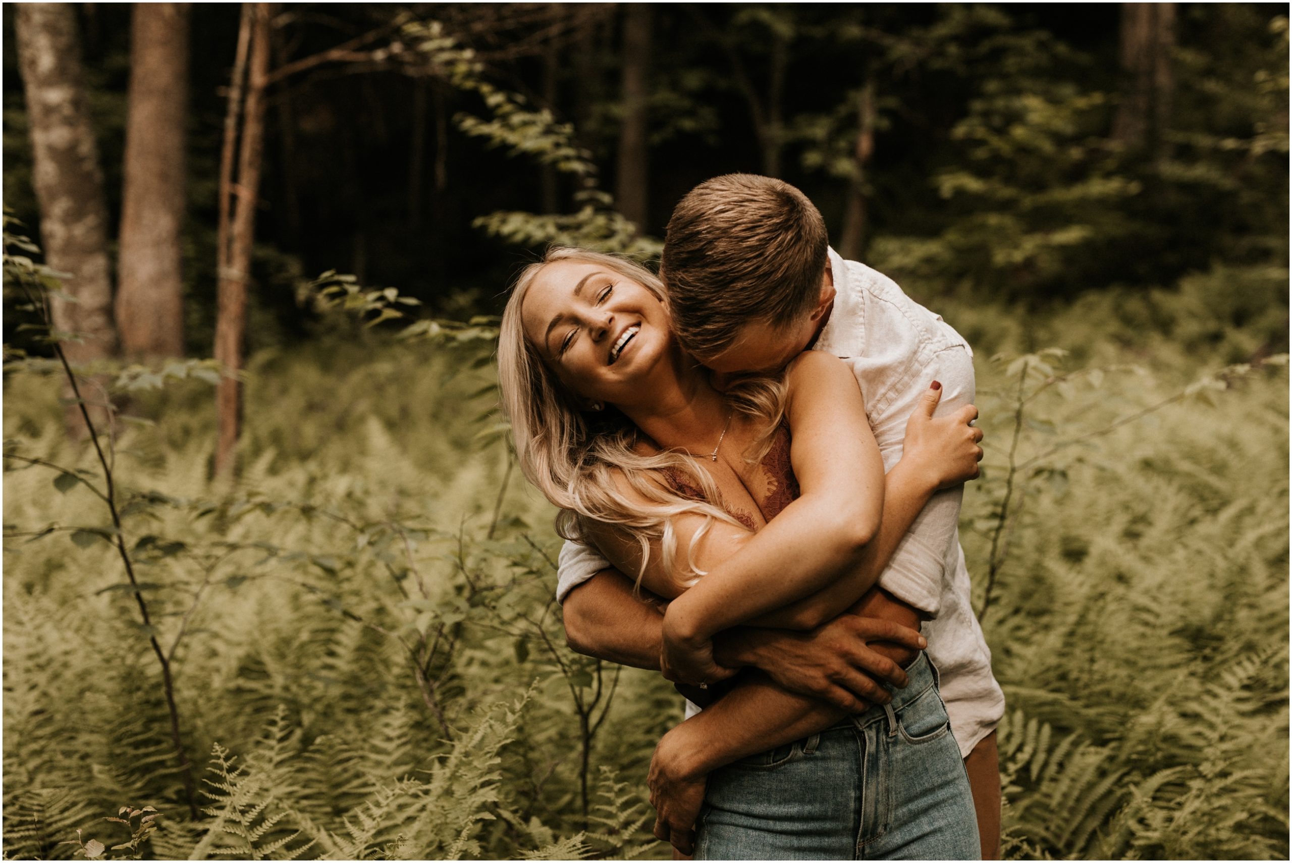 couple hugging in the woods