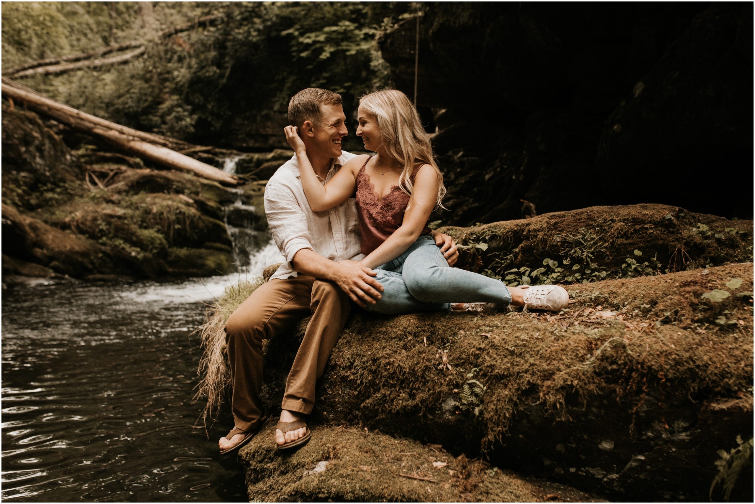 couple sitting in front of waterfall in delaware water gap new jersey