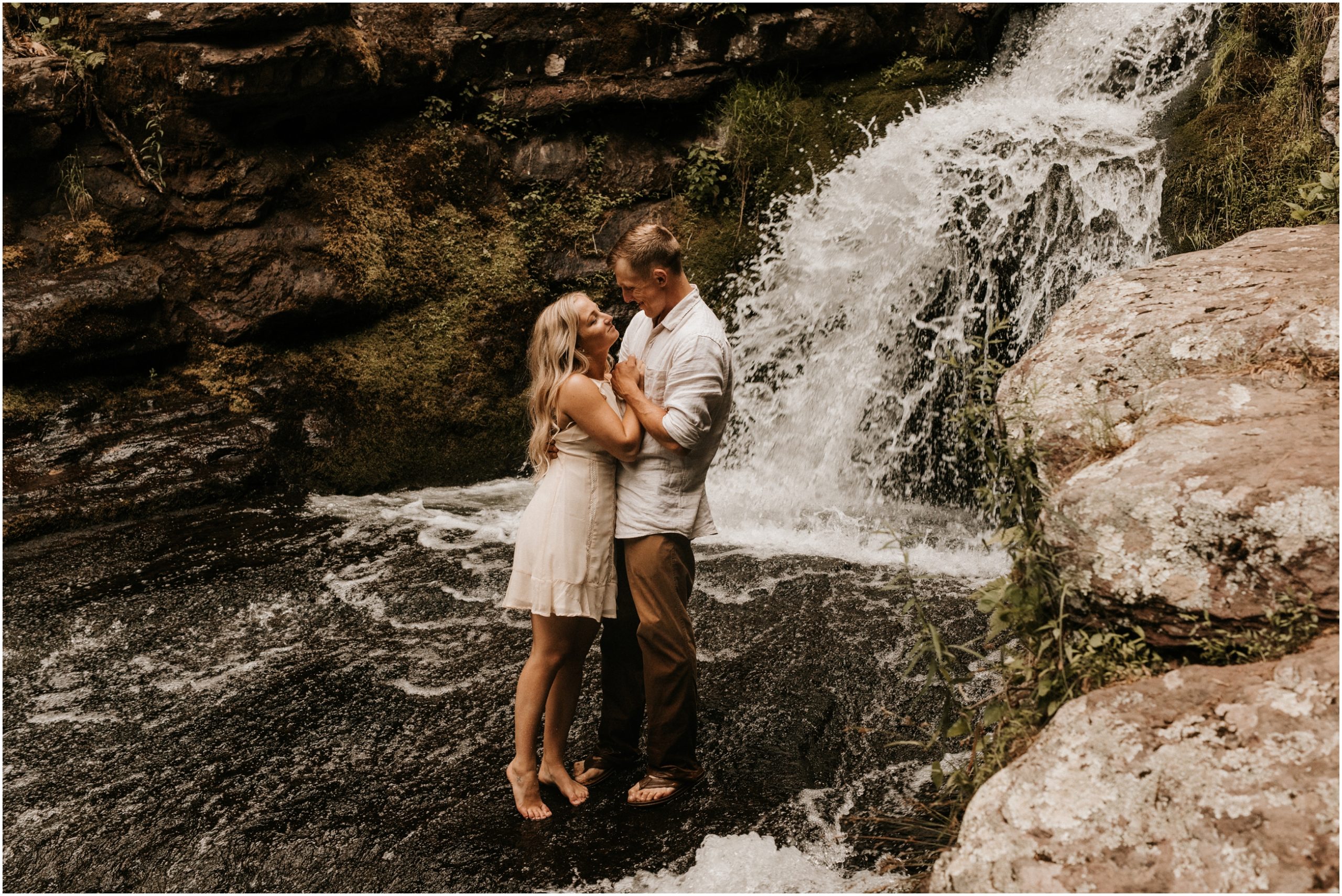 couple looking at each other in new jersey waterfall