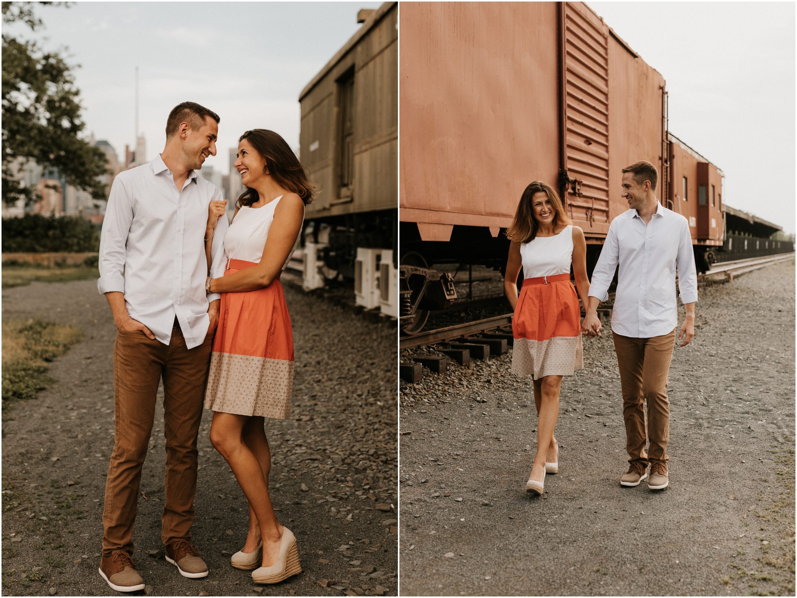 couple walking in front of old trains