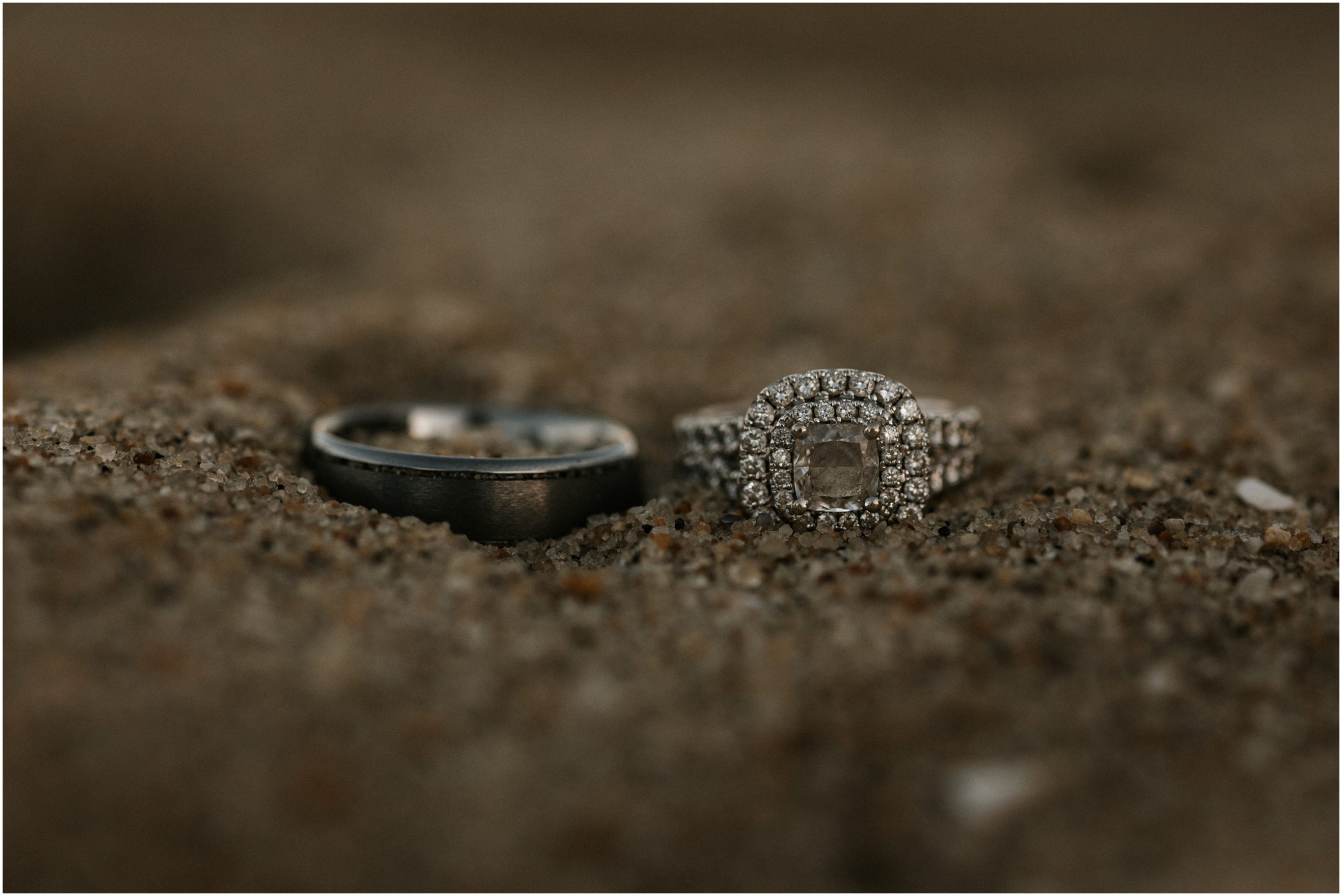 engagement ring in sand