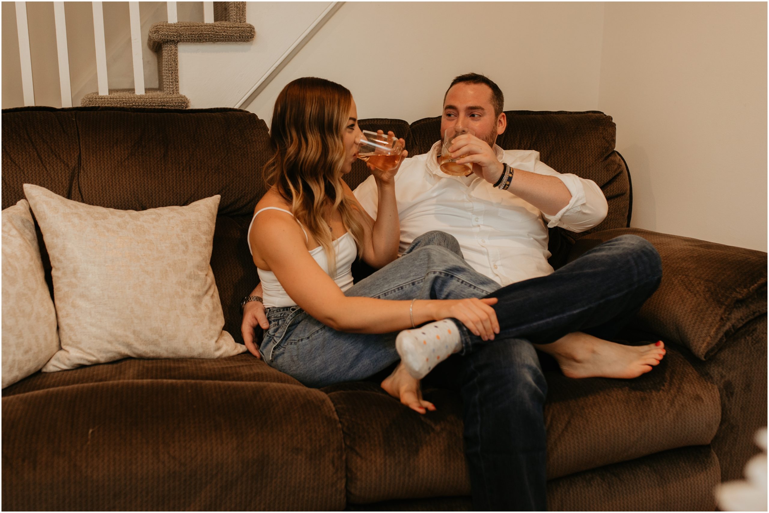 couple drinking wine on couch
