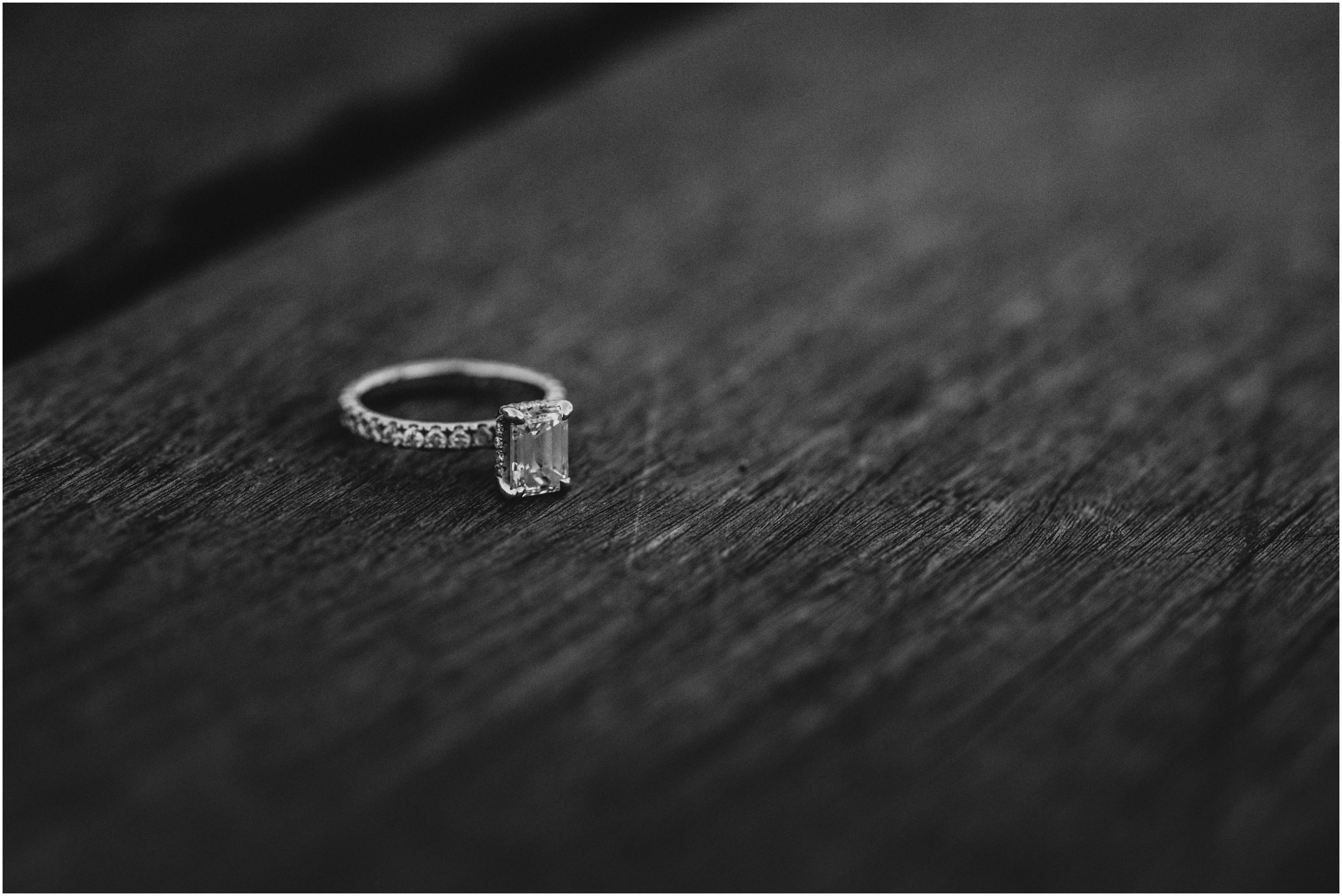 black and white image of engagement ring