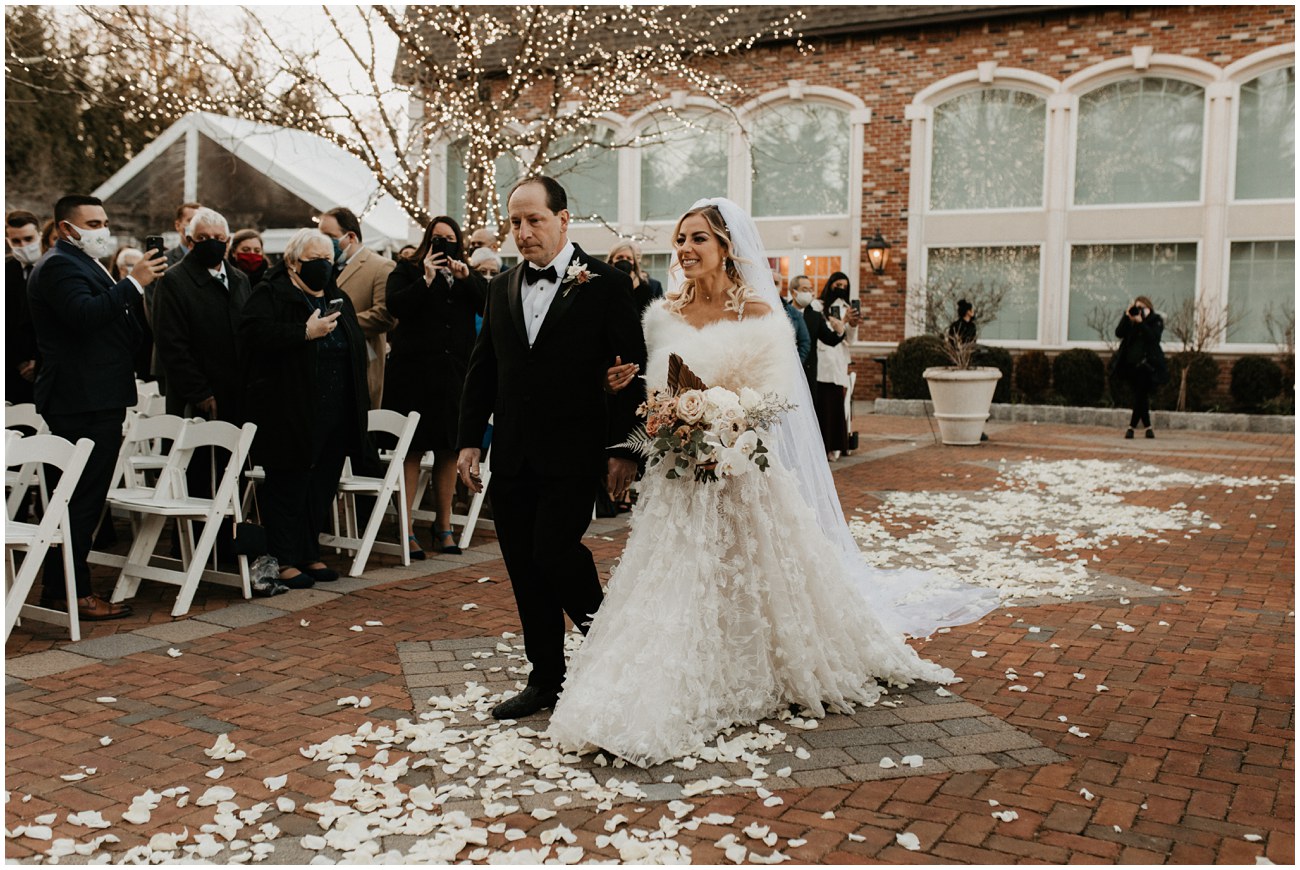 bride walking with father down aisle