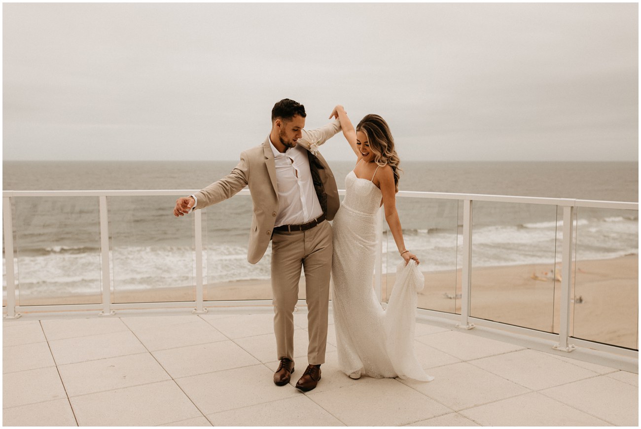 bride and groom dancing on balcony of Wave Resort in Long Branch, NJ