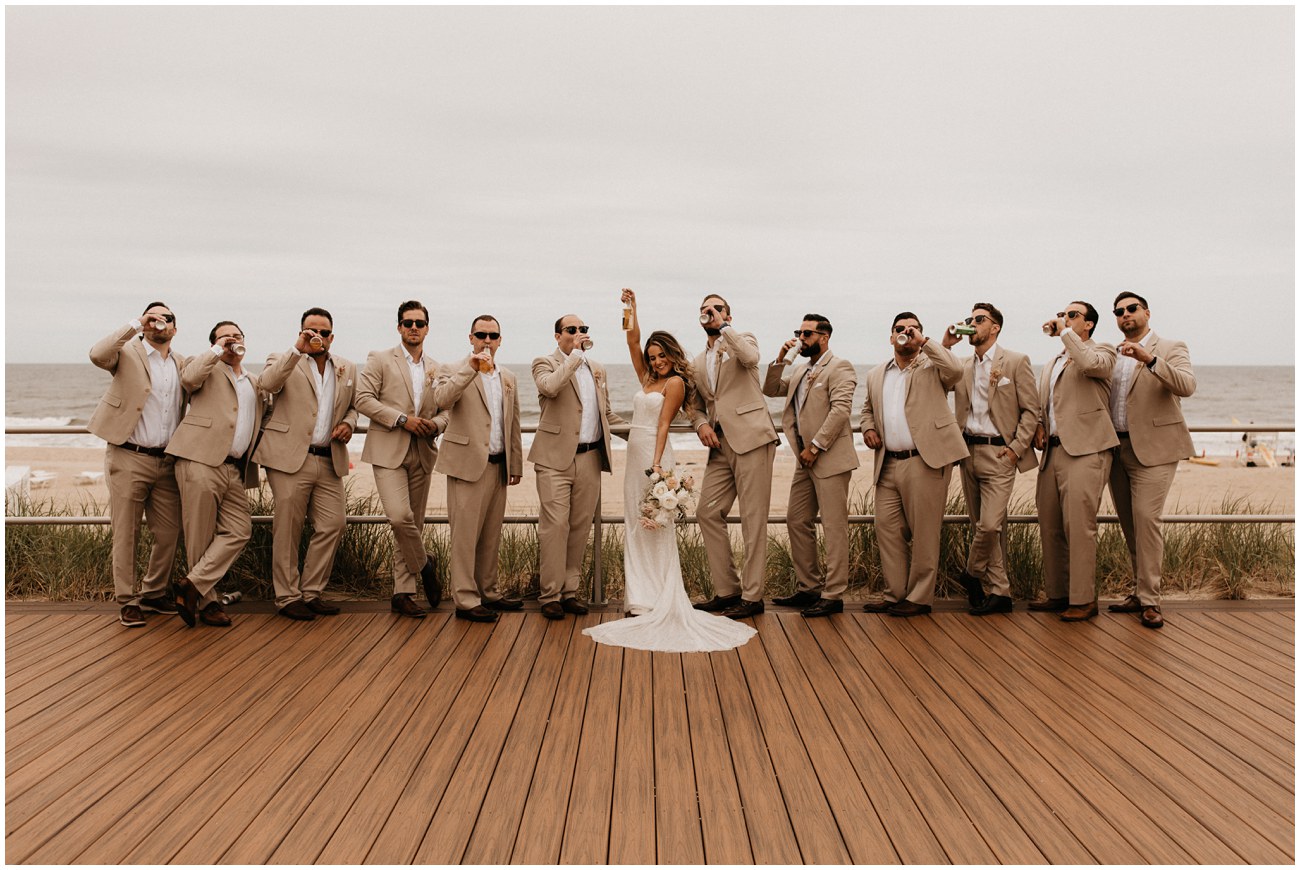 bride with groomsmen on boardwalk at Wave Resort in Long Branch, NJ