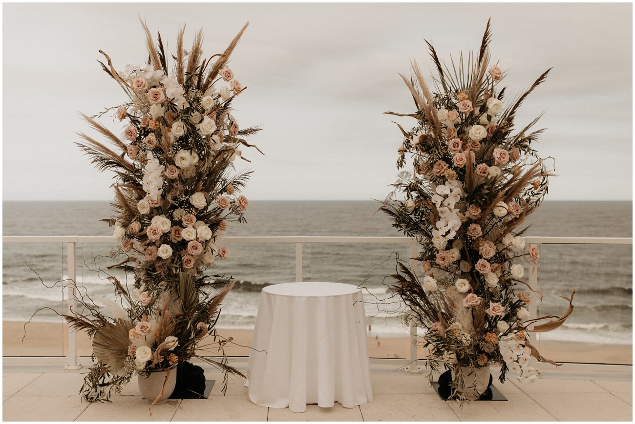 boho chic wedding florals ceremony set up on balcony of Wave Resort