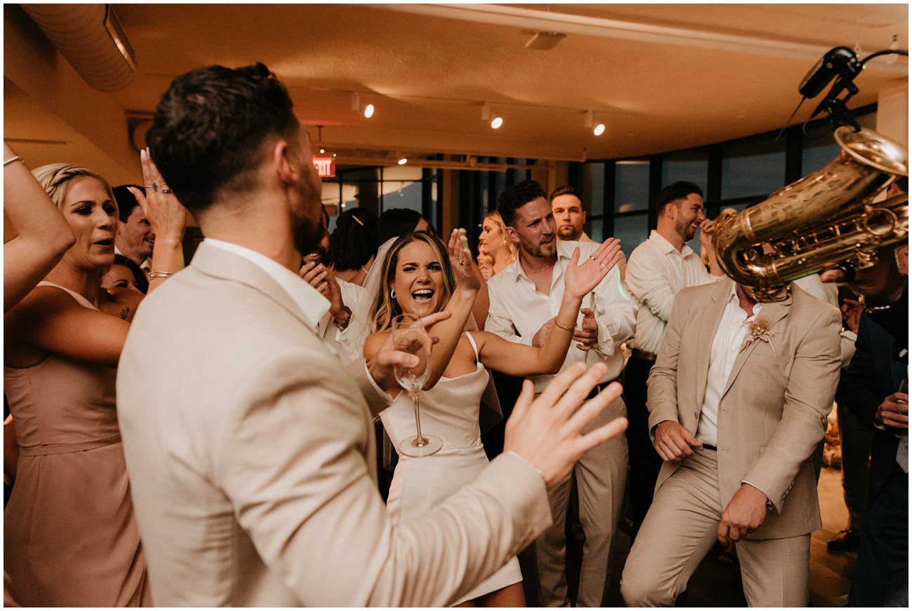 bride and groom and guests dancing at wedding reception at wave resort in long branch new jersey