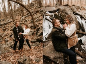 couple keeping each other warm in the winter during woodsy engagement session