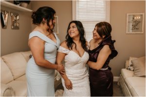 bride with maid of honor and mother