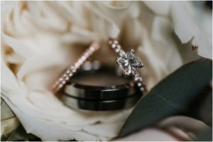 wedding rings sitting in bouquet