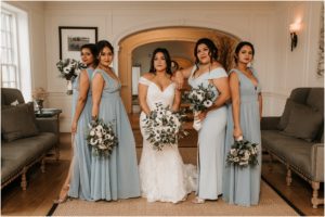 bridesmaids in blue gowns posing like models