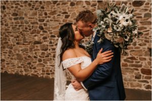 bride and groom kissing portrait