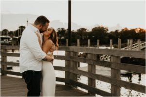 couple kissing on dock at new york waterfront