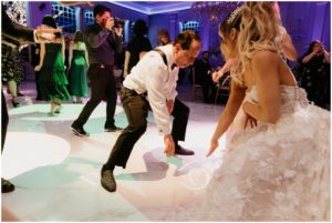 father of bride dancing during reception